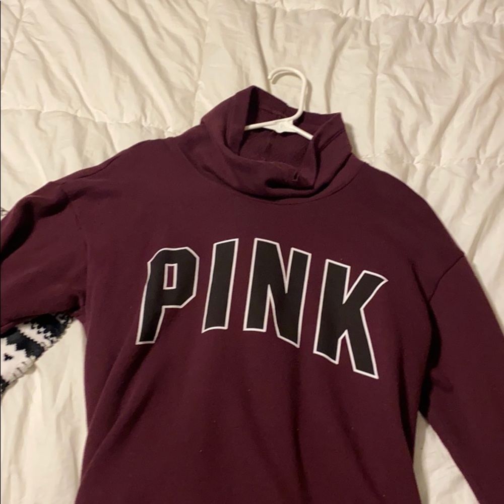 a maroon turtle neck sweater